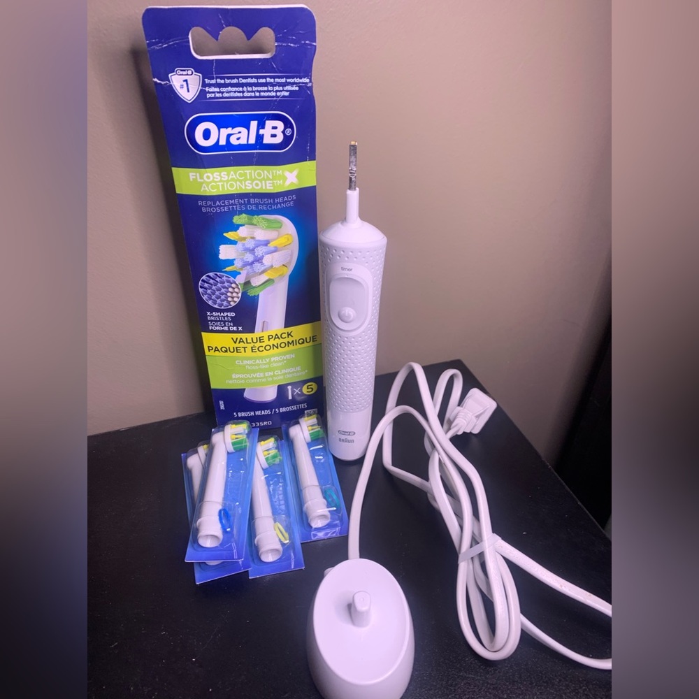 Oral-B Vitality Toothbrush with charging station and 4 replacement brush heads